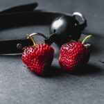 red strawberries on black surface